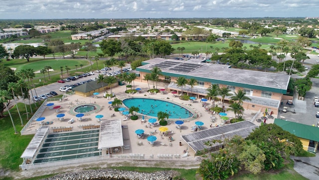 birds eye view of property with view of golf course