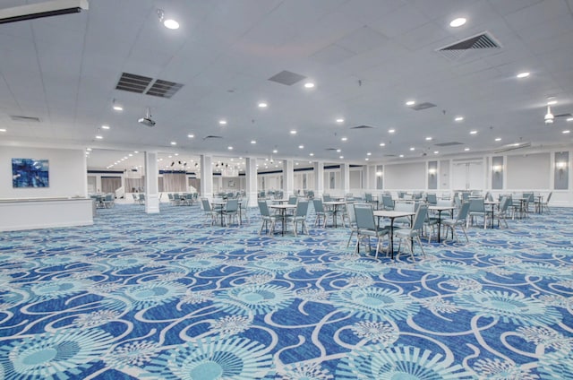 interior space with recessed lighting, carpet floors, and visible vents
