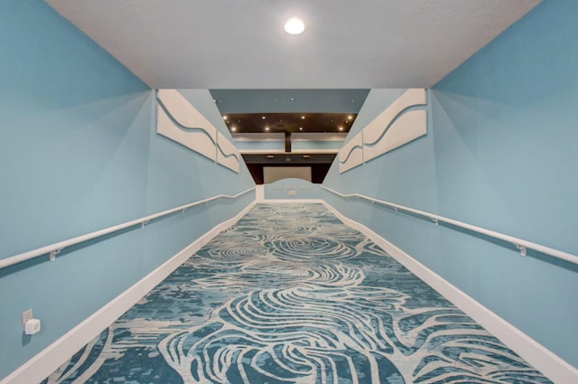 hall with recessed lighting, carpet floors, and baseboards