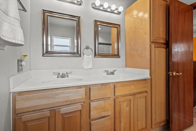 full bathroom with double vanity and a sink