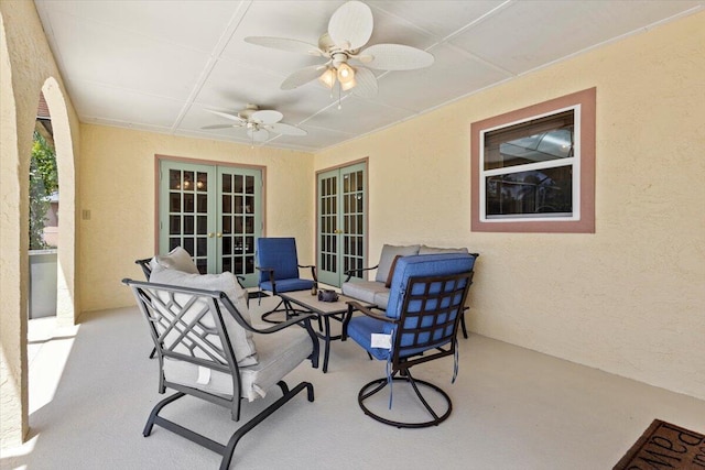 view of patio / terrace featuring a ceiling fan and french doors
