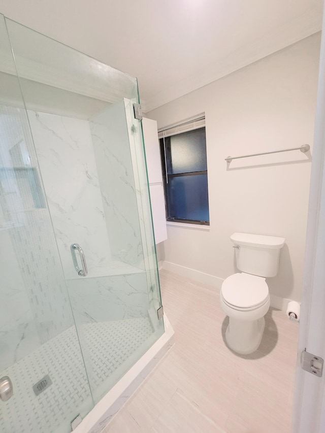 full bathroom with baseboards, a marble finish shower, and toilet