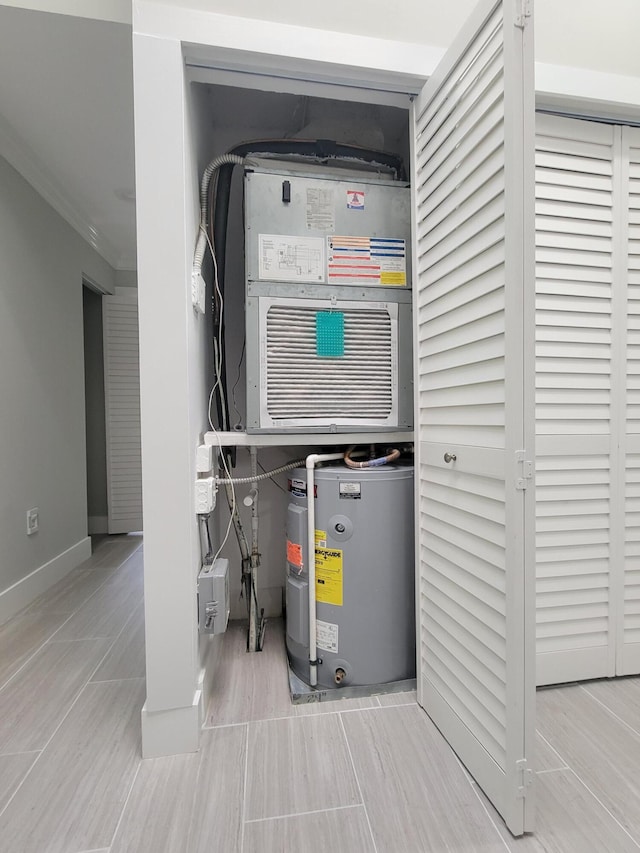 utility room with water heater