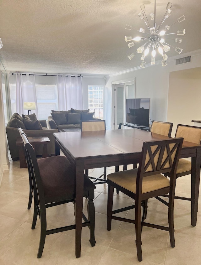 405 N Ocean Blvd Unit 507, Pompano Beach, FL 33062 - dining space with a chandelier, a textured ceiling, and light tile patterned floors
