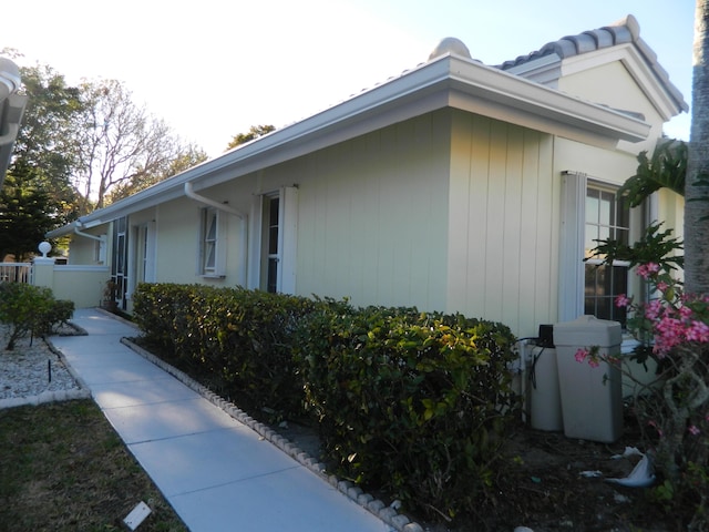 view of side of property with fence