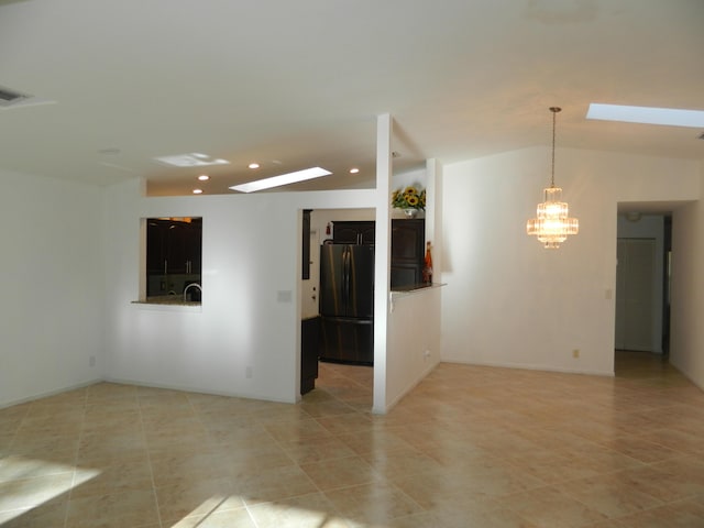 empty room featuring light tile patterned floors, recessed lighting, a notable chandelier, and visible vents