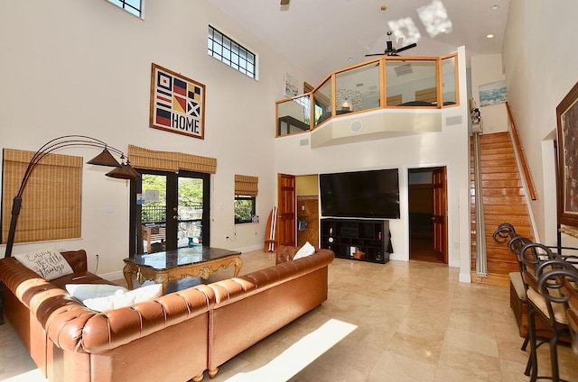 283 NE Sagamore Terrace, Port Saint Lucie, FL 34983 - living area featuring a towering ceiling, ceiling fan, and a healthy amount of sunlight
