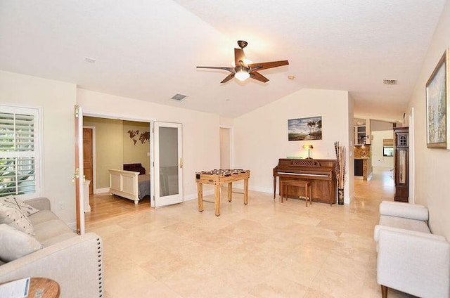 283 NE Sagamore Terrace, Port Saint Lucie, FL 34983 - living area with visible vents, a ceiling fan, vaulted ceiling, and baseboards
