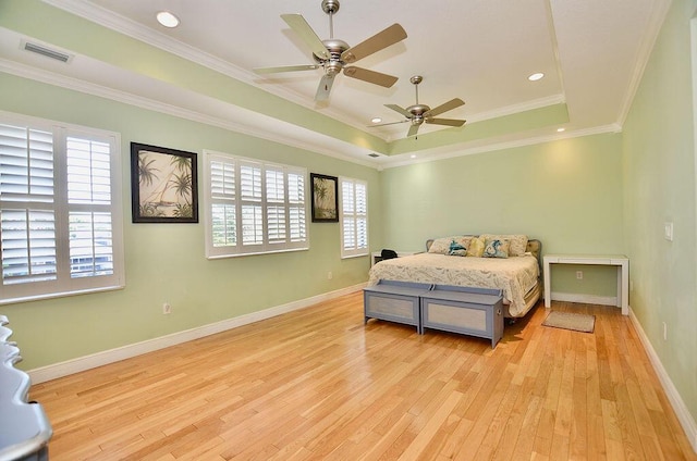 283 NE Sagamore Terrace, Port Saint Lucie, FL 34983 - bedroom featuring crown molding, a raised ceiling, visible vents, light wood-style floors, and baseboards