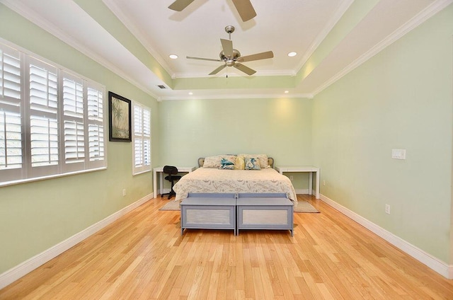 283 NE Sagamore Terrace, Port Saint Lucie, FL 34983 - bedroom with light wood-style floors, baseboards, a raised ceiling, a ceiling fan, and crown molding