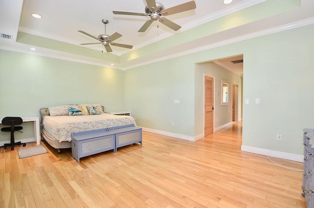 283 NE Sagamore Terrace, Port Saint Lucie, FL 34983 - bedroom with baseboards, light wood-type flooring, a raised ceiling, and crown molding