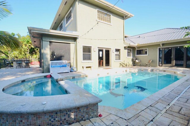 283 NE Sagamore Terrace, Port Saint Lucie, FL 34983 - view of pool featuring a patio, outdoor dry bar, and french doors