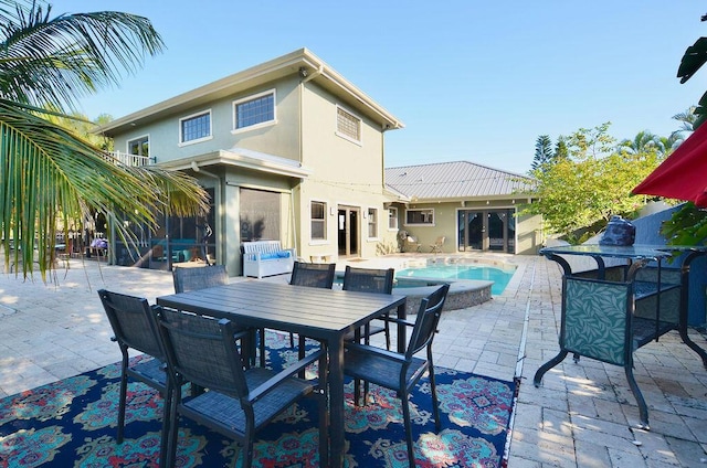 283 NE Sagamore Terrace, Port Saint Lucie, FL 34983 - view of patio featuring outdoor dining space and an outdoor pool