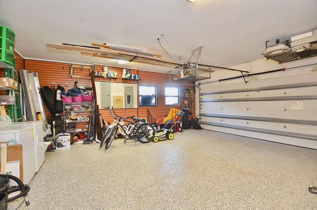 283 NE Sagamore Terrace, Port Saint Lucie, FL 34983 - garage featuring washer and clothes dryer
