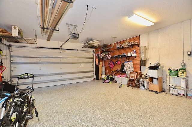 283 NE Sagamore Terrace, Port Saint Lucie, FL 34983 - garage with a garage door opener and a workshop area