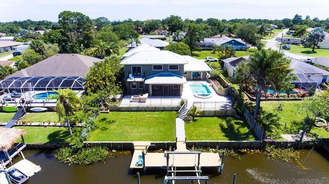 283 NE Sagamore Terrace, Port Saint Lucie, FL 34983 - bird's eye view featuring a water view and a residential view