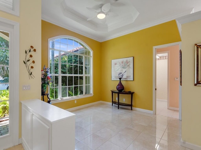 interior space featuring plenty of natural light, a ceiling fan, and ornamental molding