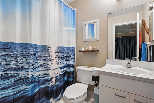 full bath featuring vanity, curtained shower, and toilet