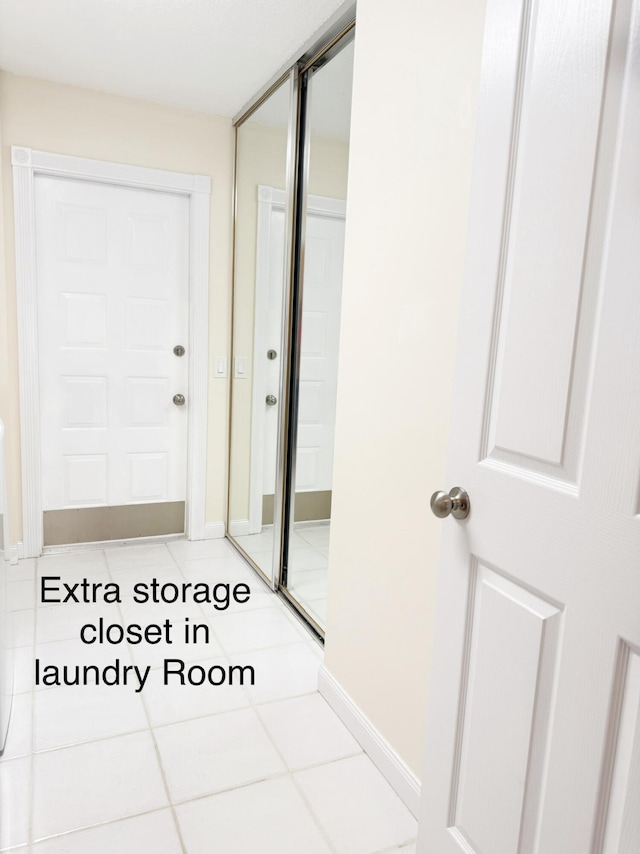 8365 SE Double Tree Dr, Hobe Sound, FL 33455 - bathroom featuring tile patterned floors and baseboards