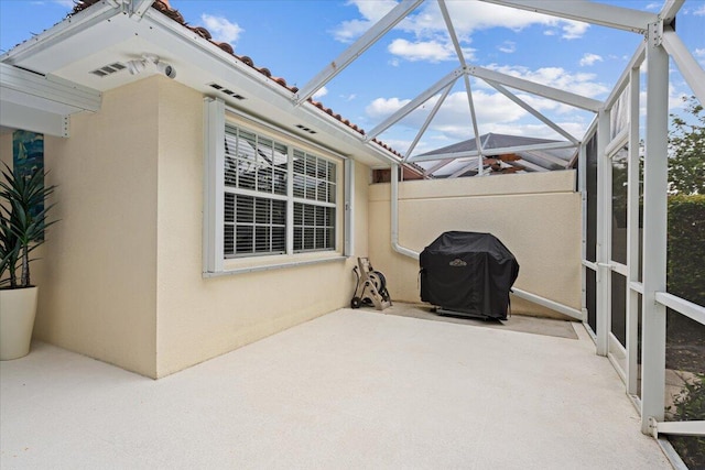 8365 SE Double Tree Dr, Hobe Sound, FL 33455 - view of patio with a grill and a lanai