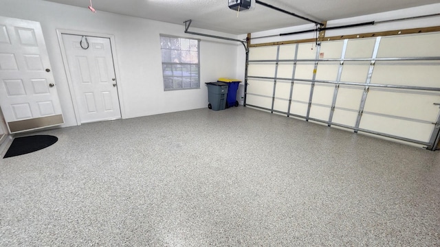 8365 SE Double Tree Dr, Hobe Sound, FL 33455 - garage featuring a garage door opener