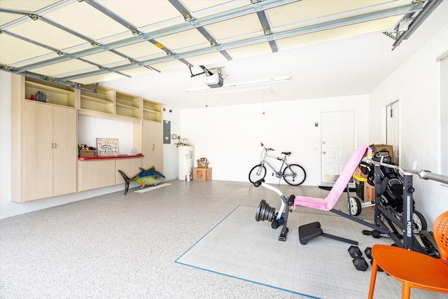 8365 SE Double Tree Dr, Hobe Sound, FL 33455 - garage with water heater, electric panel, and a garage door opener