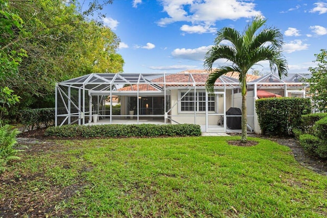 8365 SE Double Tree Dr, Hobe Sound, FL 33455 - rear view of house with a yard, a patio area, a lanai, and stucco siding