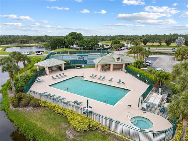 8365 SE Double Tree Dr, Hobe Sound, FL 33455 - community pool with fence, a community hot tub, a gazebo, and a water view