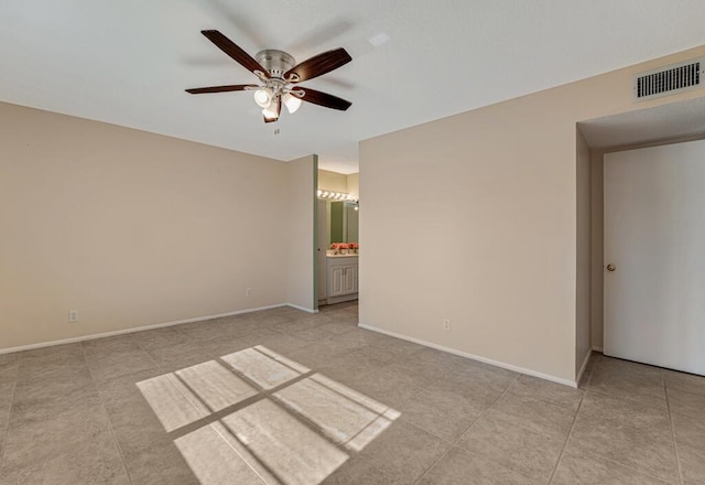 176 Lake Carol Dr, West Palm Beach, FL 33411 - spare room with light tile patterned floors, baseboards, visible vents, and ceiling fan