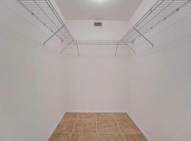 176 Lake Carol Dr, West Palm Beach, FL 33411 - spacious closet featuring visible vents and light tile patterned floors