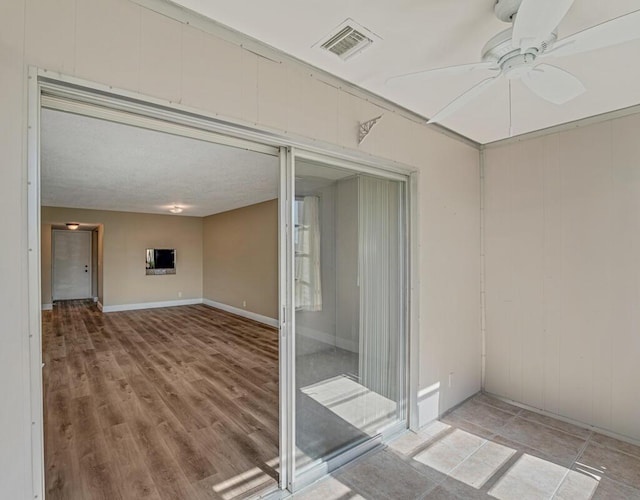 176 Lake Carol Dr, West Palm Beach, FL 33411 - interior space featuring wood finished floors, baseboards, a ceiling fan, and visible vents