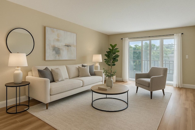 176 Lake Carol Dr, West Palm Beach, FL 33411 - living area featuring light wood finished floors and baseboards