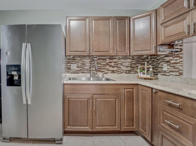 176 Lake Carol Dr, West Palm Beach, FL 33411 - kitchen featuring backsplash, light tile patterned floors, a sink, and stainless steel fridge with ice dispenser