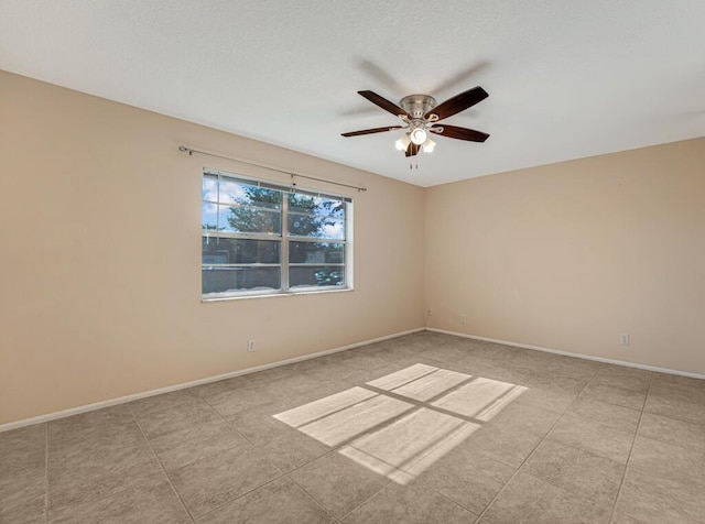 176 Lake Carol Dr, West Palm Beach, FL 33411 - tiled spare room featuring a ceiling fan and baseboards