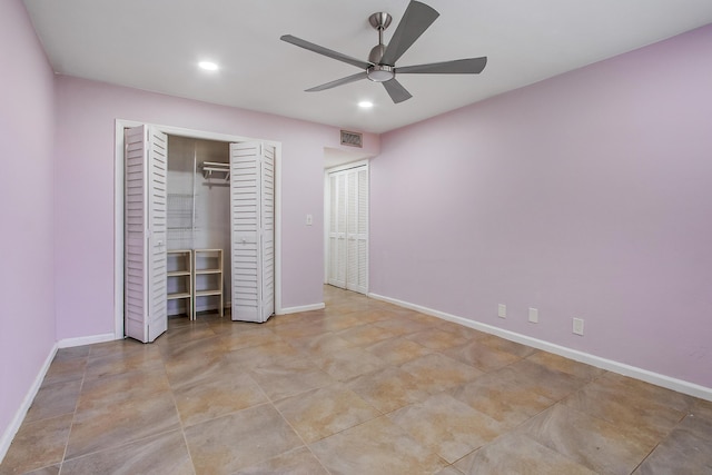unfurnished bedroom featuring baseboards, a closet, visible vents, and recessed lighting