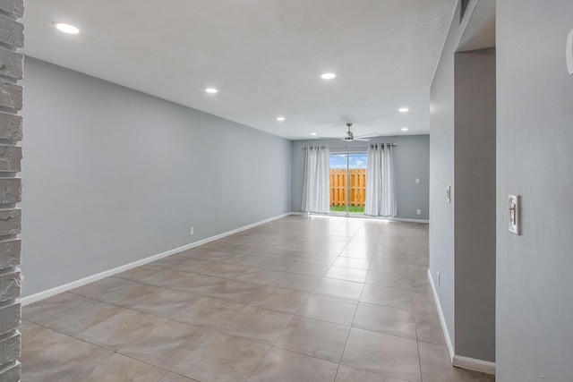 spare room featuring recessed lighting, baseboards, ceiling fan, and light tile patterned floors