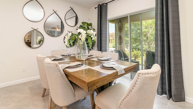 dining area featuring baseboards and light tile patterned floors