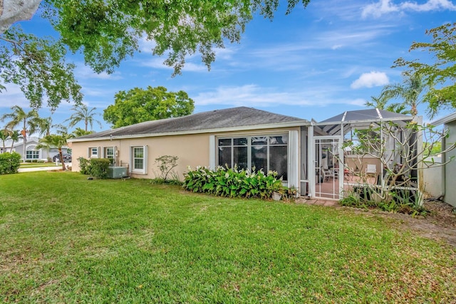 7829 Mansfield Hollow Rd, Delray Beach, FL 33446 - rear view of house with a lanai, a yard, and stucco siding