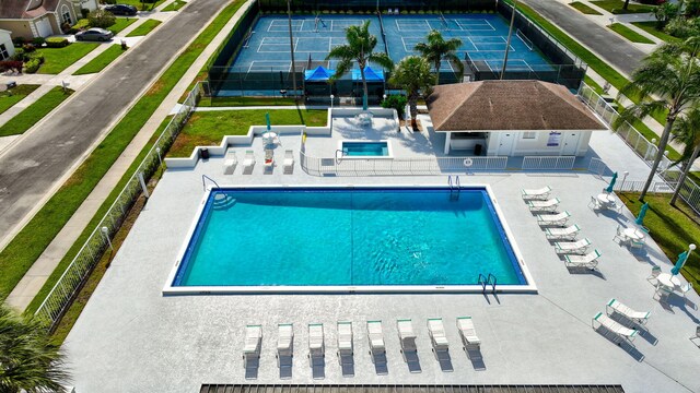 7829 Mansfield Hollow Rd, Delray Beach, FL 33446 - pool with fence and a patio area