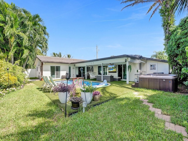 3821 NE 29th Ave, Lighthouse Point, FL 33064 - rear view of property with a hot tub, stucco siding, ceiling fan, an outdoor hangout area, and a tile roof