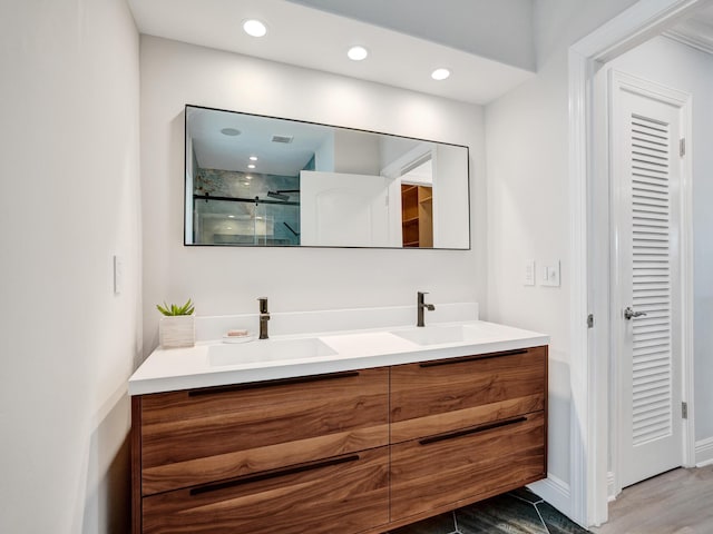 3821 NE 29th Ave, Lighthouse Point, FL 33064 - bathroom featuring a stall shower, double vanity, and recessed lighting