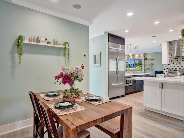 3821 NE 29th Ave, Lighthouse Point, FL 33064 - dining room featuring ornamental molding, light wood-style flooring, recessed lighting, and baseboards