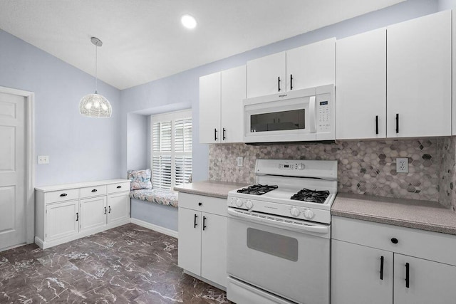 kitchen with white appliances, marble finish floor, vaulted ceiling, light countertops, and white cabinets