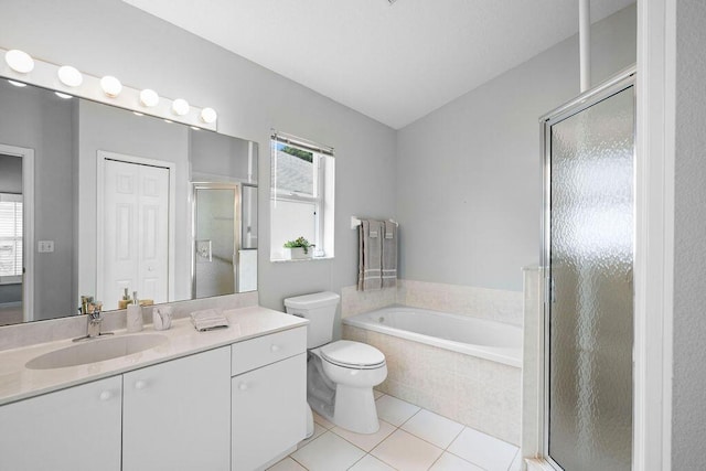 bathroom with tile patterned flooring, toilet, a bath, vanity, and a stall shower