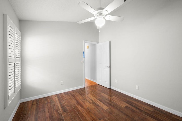 unfurnished bedroom with ceiling fan, wood finished floors, and baseboards