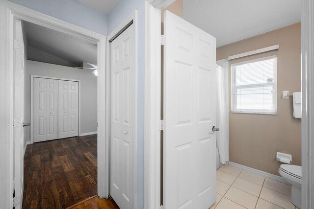 hall featuring baseboards