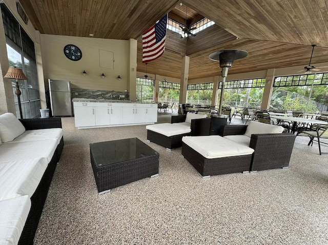 view of patio featuring an outdoor kitchen, an outdoor hangout area, and outdoor dining area