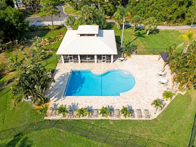 view of swimming pool with fence, a lawn, a patio area, and a fenced in pool