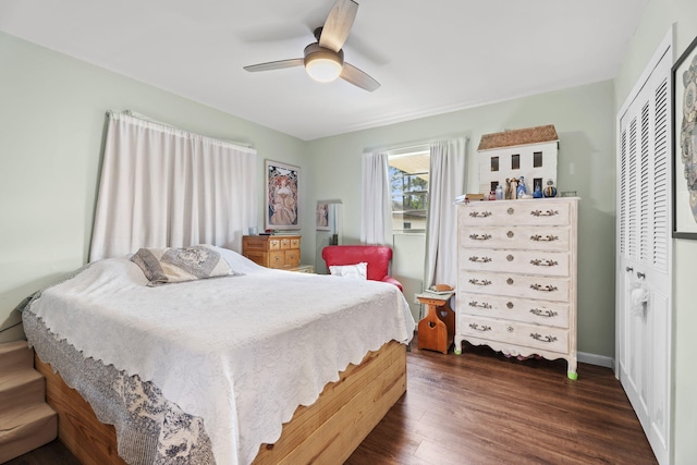 1728 SE Harrison St, Stuart, FL 34997 - bedroom featuring ceiling fan, dark wood finished floors, and a closet