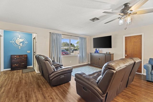1728 SE Harrison St, Stuart, FL 34997 - living area with baseboards, ceiling fan, wood finished floors, and visible vents